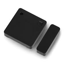 A compact, discreet Shelly BLU Door/Window smart home sensor consisting of two magnetic parts, designed for installation on door and window frames to detect openings